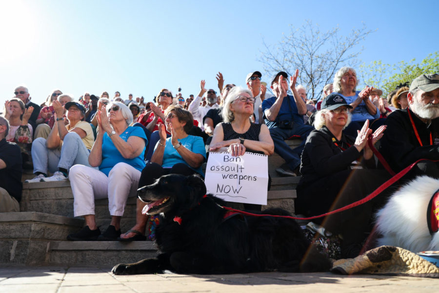 Laura Robinson holds a sign that reads, “Ban assault weapons now” during the community vigil honoring the victims of the Louisville mass shooting on Wednesday, April 12, 2023, at the Muhammad Ali Center plaza in Louisville, Kentucky. Kentucky Lantern photo by Abbey Cutrer