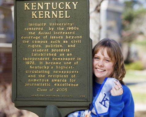 2021-2023 Kentucky Kernel Editor-in-Chief Rayleigh Deaton poses with her graduation stole and the Kernel historical marker at the University of Kentucky on March 29, 2023. Photo by Michael Clubb | Staff file photo