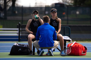 Kentucky Wildcats senior Florencia Urrutia and sophomore Lidia Gonzalez take a water break between sets on the bench during the Kentucky vs. Alabama womens tennis match on Sunday, April 2, 2023, at Boone Tennis Complex in Lexington, Kentucky. Alabama won 4-1. Photo by Carter Skaggs | Staff