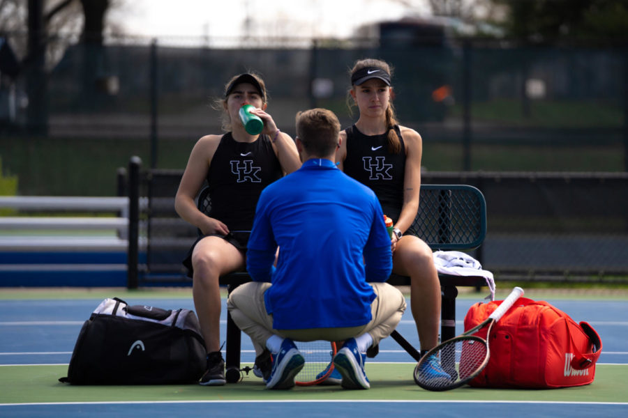 Kentucky Wildcats senior Florencia Urrutia and sophomore Lidia Gonzalez take a water break between sets on the bench during the Kentucky vs. Alabama womens tennis match on Sunday, April 2, 2023, at Boone Tennis Complex in Lexington, Kentucky. Alabama won 4-1. Photo by Carter Skaggs | Staff