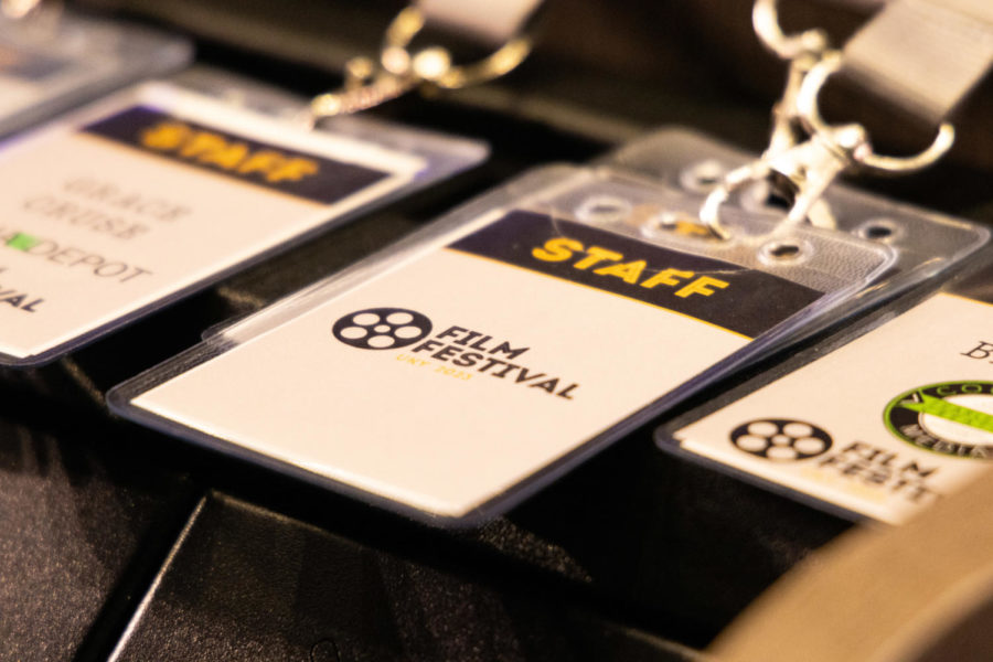 Staff lanyards are draped over a podium during the 2023 Student Film Festival on Friday, April 28, 2023, in the Gatton Student Center in Lexington, Kentucky. Photo by Samuel Colmar | Staff