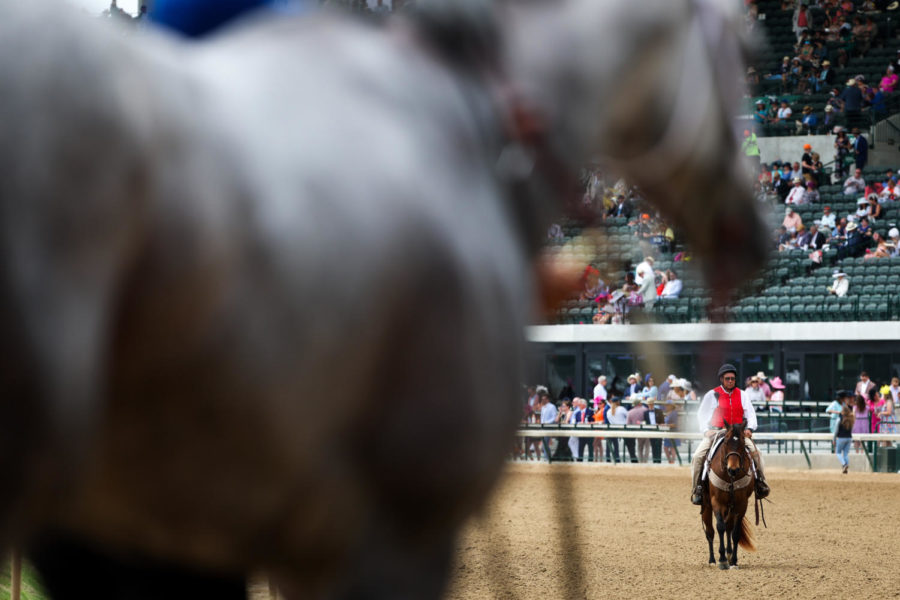 A man rides his horse during the 149th Kentucky Derby on Saturday, May 6, 2023, in Churchill Downs in Louisville, Kentucky. Photo by Samuel Colmar | Staff
