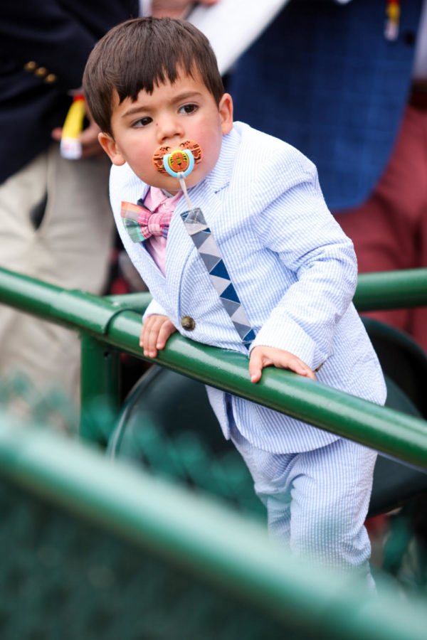A child watches a race during the 149th Kentucky Derby on Saturday, May 6, 2023, in Churchill Downs in Louisville, Kentucky. Photo by Samuel Colmar | Staff