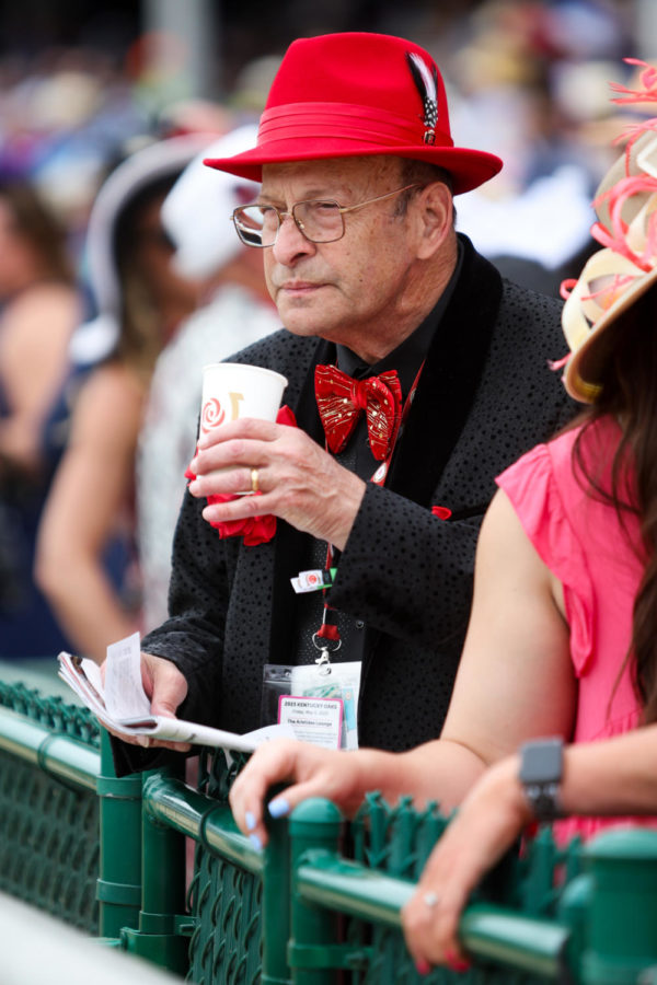 A Derby goer holds a drink during the 149th Kentucky Derby on Saturday, May 6, 2023, in Churchill Downs in Louisville, Kentucky. Photo by Samuel Colmar | Staff