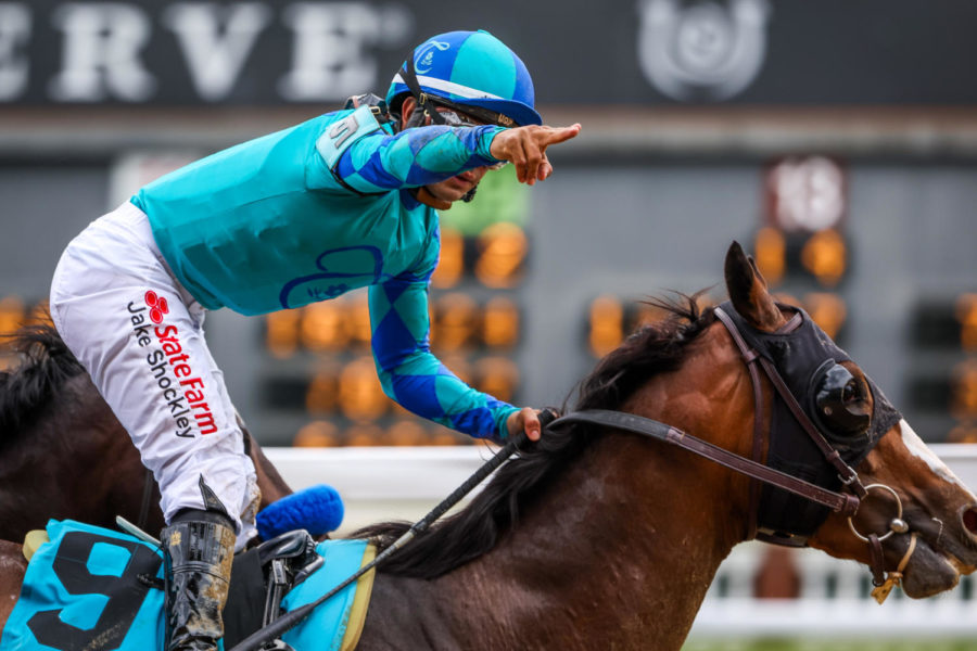 A jockey points during the 149th Kentucky Derby on Saturday, May 6, 2023, in Churchill Downs in Louisville, Kentucky. Photo by Samuel Colmar | Staff