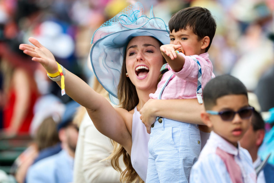 Derby goers hold out their hands during the 149th Kentucky Derby on Saturday, May 6, 2023, in Churchill Downs in Louisville, Kentucky. Photo by Samuel Colmar | Staff