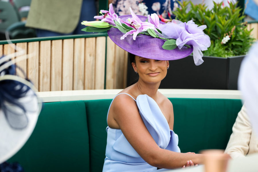 A Derby goer smiles during the 149th Kentucky Derby on Saturday, May 6, 2023, in Churchill Downs in Louisville, Kentucky. Photo by Samuel Colmar | Staff