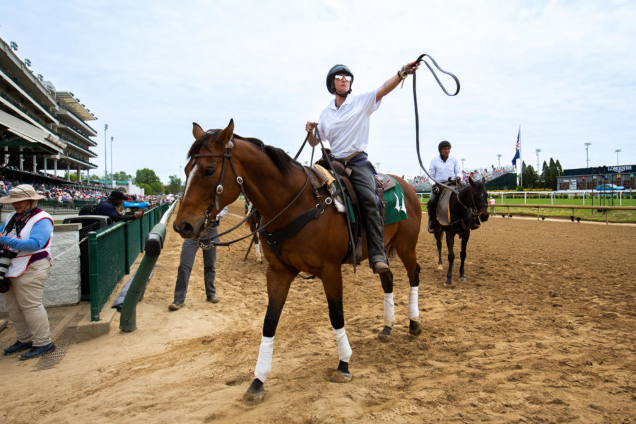 A horseback rider holds a lead the 149th Kentucky Derby on Saturday, May 6, 2023, in Churchill Downs in Louisville, Kentucky. Photo by Samuel Colmar | Staff