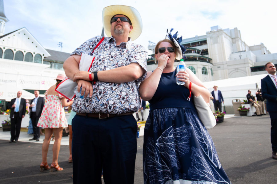 Derby goers watch a race on television during the 149th Kentucky Derby on Saturday, May 6, 2023, in Churchill Downs in Louisville, Kentucky. Photo by Samuel Colmar | Staff