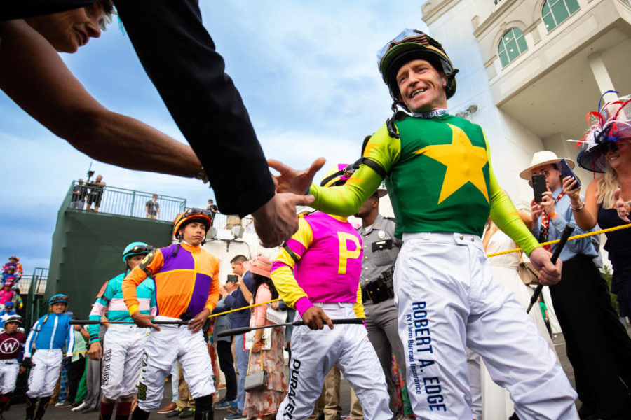 Jockeys walk to the track before the 149th Kentucky Derby on Saturday, May 6, 2023, in Churchill Downs in Louisville, Kentucky. Photo by Samuel Colmar | Staff