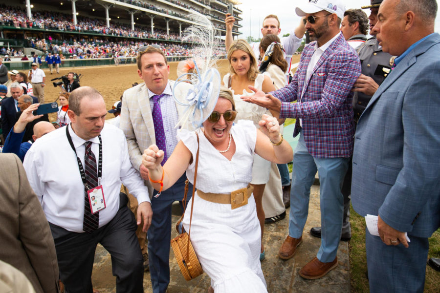A Derby goer celebrates during the 149th Kentucky Derby on Saturday, May 6, 2023, in Churchill Downs in Louisville, Kentucky. Photo by Samuel Colmar | Staff
