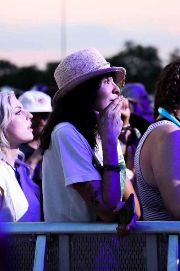 A Weezer fan cries during the set on Saturday, June 3, 2023, during the Railbird music festival at the Red Mile infield in Lexington, Kentucky. Photo by Abbey Cutrer | Staff