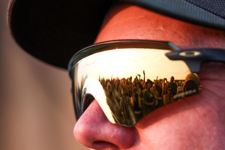 A security guard watches the crowd as Weezer performs on Saturday, June 3, 2023, during the Railbird music festival at the Red Mile infield in Lexington, Kentucky. Photo by Abbey Cutrer | Staff