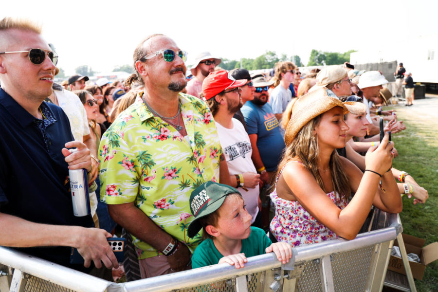 A father watches Goose perform with his son on Sunday, June 4, 2023, during the Railbird music festival at the Red Mile infield in Lexington, Kentucky. Photo by Abbey Cutrer | Staff