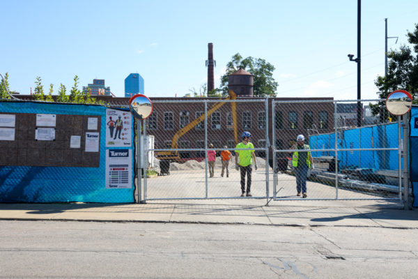 Turner construction workers walk out of the UK College of Design construction site after human remains were found on Friday, Aug. 18, 2023, on Scott Street in Lexington, Kentucky. Photo by Abbey Cutrer | Staff