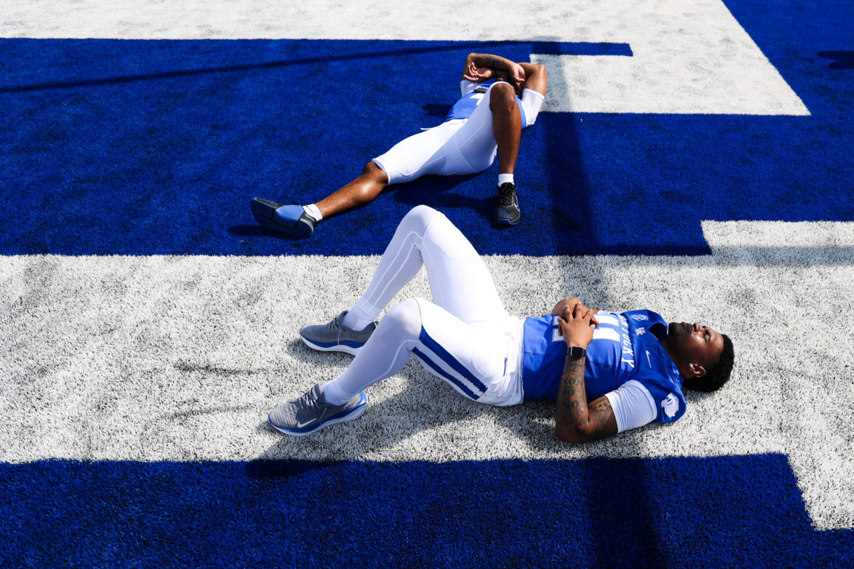 Kentucky Wildcats running back JuTahn McClain (4)and defensive back Zion Childress (11) lay in the end zone during Media Day on Friday, Aug. 4, 2023, at Kroger Field in Lexington, Kentucky. Photo by Abbey Cutrer | Staff