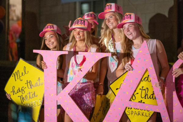 Theta members pose for photos during Bid Day at the University of Kentucky on Tuesday, Sept. 5, 2023, in Lexington, Kentucky. Photo by Travis Fannon | Staff