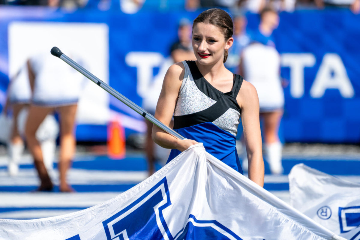 University of Kentucky color guard member wavies their flag during the Kentucky vs. Florida football game on Saturday, Sept. 30, 2023, at Kroger Field in Lexington, Kentucky. Kentucky won 33-14. Photo by Travis Fannon | Staff