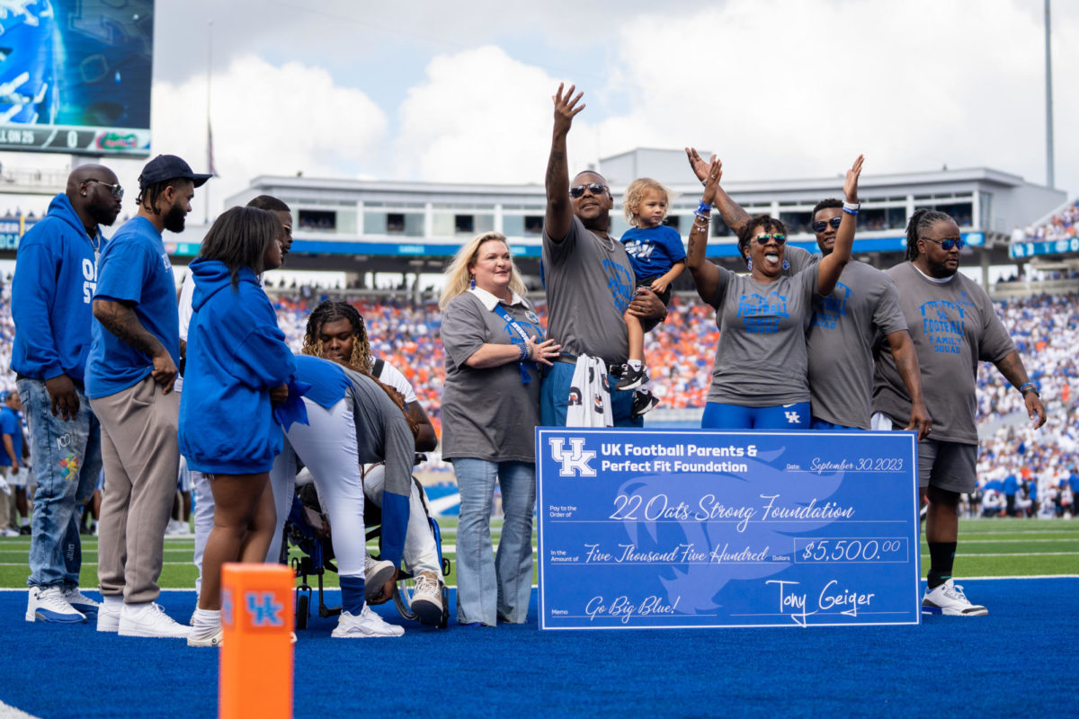 Chris Oats and others stand on the field during the Kentucky vs. Florida football game on Saturday, Sept. 30, 2023, at Kroger Field in Lexington, Kentucky. Kentucky won 33-14. Photo by Travis Fannon | Staff
