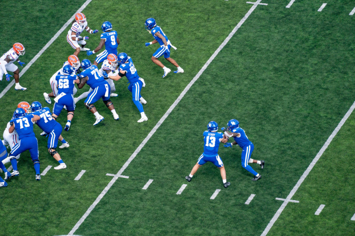 Kentucky quarterback Devin Leary hands off the ball to a running back during the Kentucky vs. Florida football game on Saturday, Sept. 30, 2023, at Kroger Field in Lexington, Kentucky. Kentucky won 33-14. Photo by Savanna Emrick | Staff