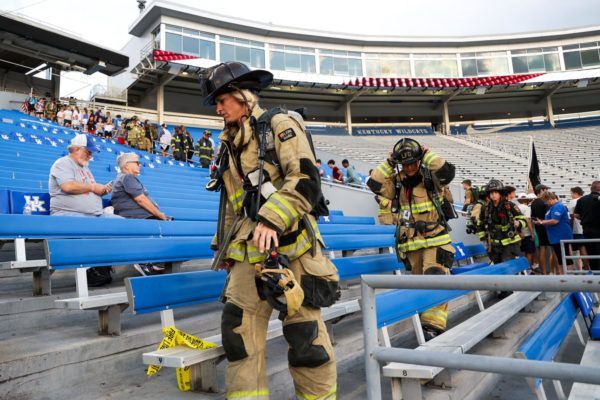 Lexington Firefighter Sarah McGill leads the 110 flight walk during the 9/11 Memorial Stair Climb on Monday, Sept. 11, 2023, at Kroger Field in Lexington, Kentucky. Over 500 people gathered to honor the first responders who gave their lives rushing into the World Trade Center on 9/11. Photo by Abbey Cutrer | Staff