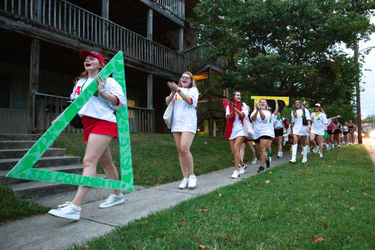 Members walk to their chapter houses during Bid Day at the University of Kentucky on Tuesday, Sept. 5, 2023, in Lexington, Kentucky. Photo by Samuel Colmar | Staff