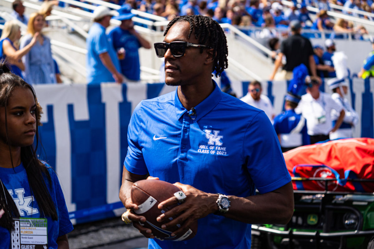 Former Kentucky Wildcats guard Rajon Rondo watches on the sideline during the Kentucky vs. Florida football game on Saturday, Sept. 30, 2023, at Kroger Field in Lexington, Kentucky. UK won 33-14. Photo by Isaiah Pinto | Staff