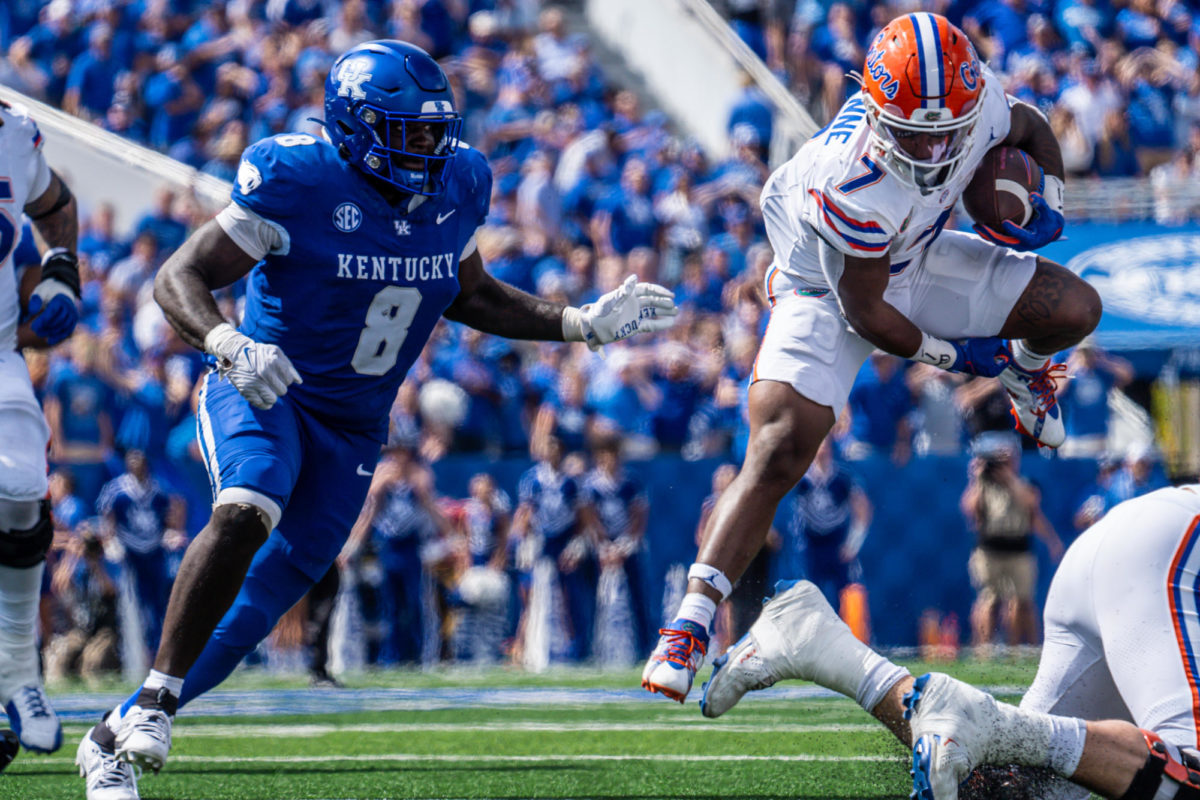 Kentucky Wildcats defensive lineman Octavious Oxendine pursues Florida Gators running back Trevor Etienne (7) during the Kentucky vs. Florida football game on Saturday, Sept. 30, 2023, at Kroger Field in Lexington, Kentucky. UK won 33-14. Photo by Isaiah Pinto | Staff