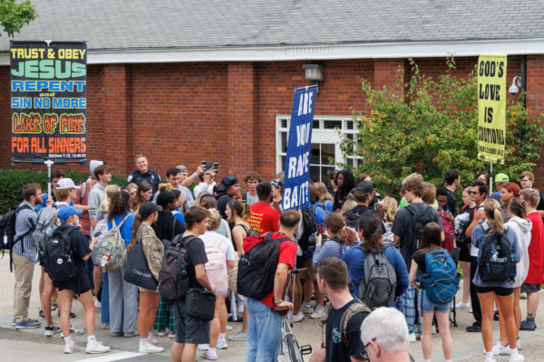 Students gather around protestors on Monday, Sept. 25, 2023, at University of Kentucky in Lexington, Kentucky. Photo by Matthew Mueller | Staff