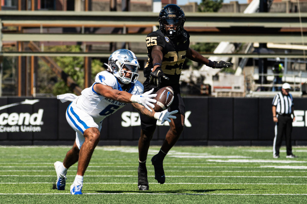 Kentucky Wildcats wideout Dane Key (6) extends for the football against Vanderbilt Commodores cornerback Martel Hight (25) during the Kentucky vs. Vanderbilt football game on Saturday, Sept. 23, 2023 at FirstBank Stadium in Nashville, Tennessee. UK won 45-28. Photo by Isaiah Pinto | Staff