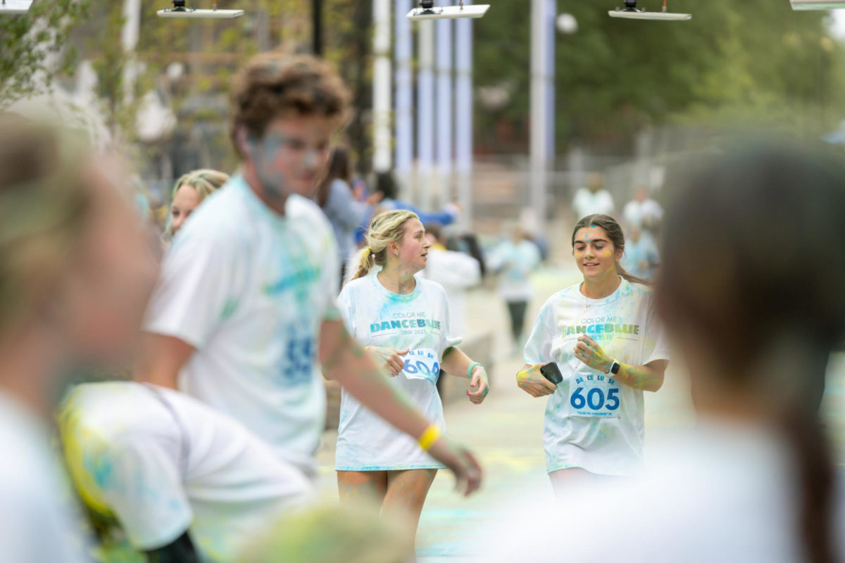 Runners cross the finish line during the Dance Blue 5K Color Run on Sunday, Oct. 8, 2023, at the University of Kentucky in Lexington, Kentucky. Photo by Travis Fannon | Staff
