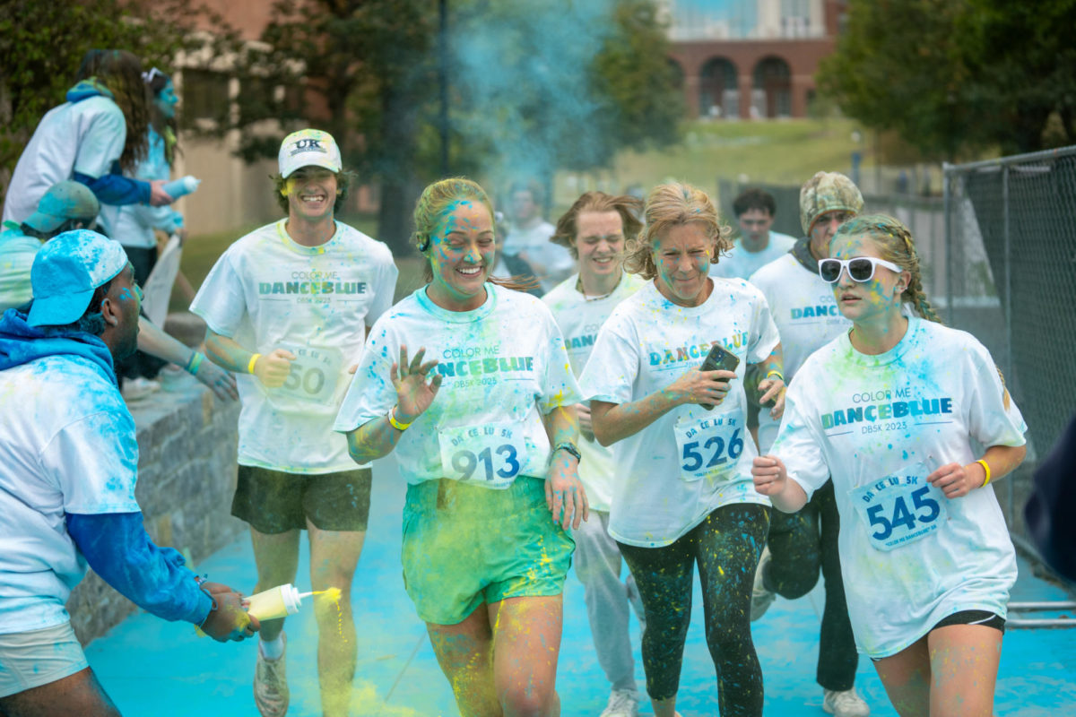 Runners are splashed with color during the Dance Blue 5K Color Run on Sunday, Oct. 8, 2023, at the University of Kentucky in Lexington, Kentucky. Photo by Travis Fannon | Staff