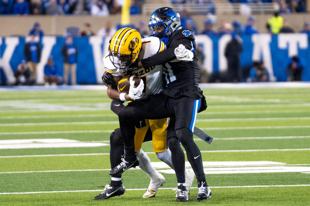 Kentucky defensive back Zion Childress tackles a Missouri player during the Kentucky vs. Missouri football game on Saturday, Oct. 14, 2023, at Kroger Field in Lexington, Kentucky. Kentucky lost 38-21. Photo by Travis Fannon | Staff