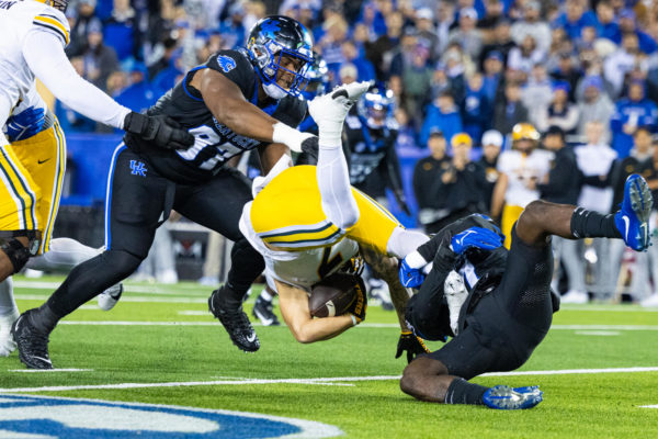 Kentucky defenders attack Missouri running back Cody Schrader during the Kentucky vs. Missouri football game on Saturday, Oct. 14, 2023, at Kroger Field in Lexington, Kentucky. Kentucky lost 38-21. Photo by Isaiah Pinto | Staff
