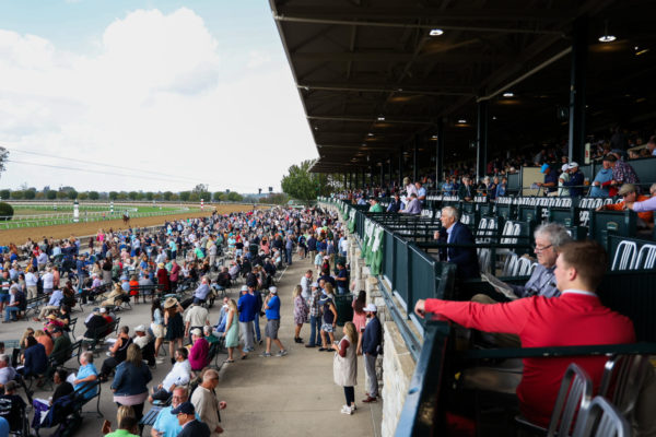 Crowds fill the benches close to the track on the opening day of the Fall Meet on Friday, Oct. 6, 2023, at Keeneland in Lexington, Kentucky. Photo by Abbey Cutrer | Staff