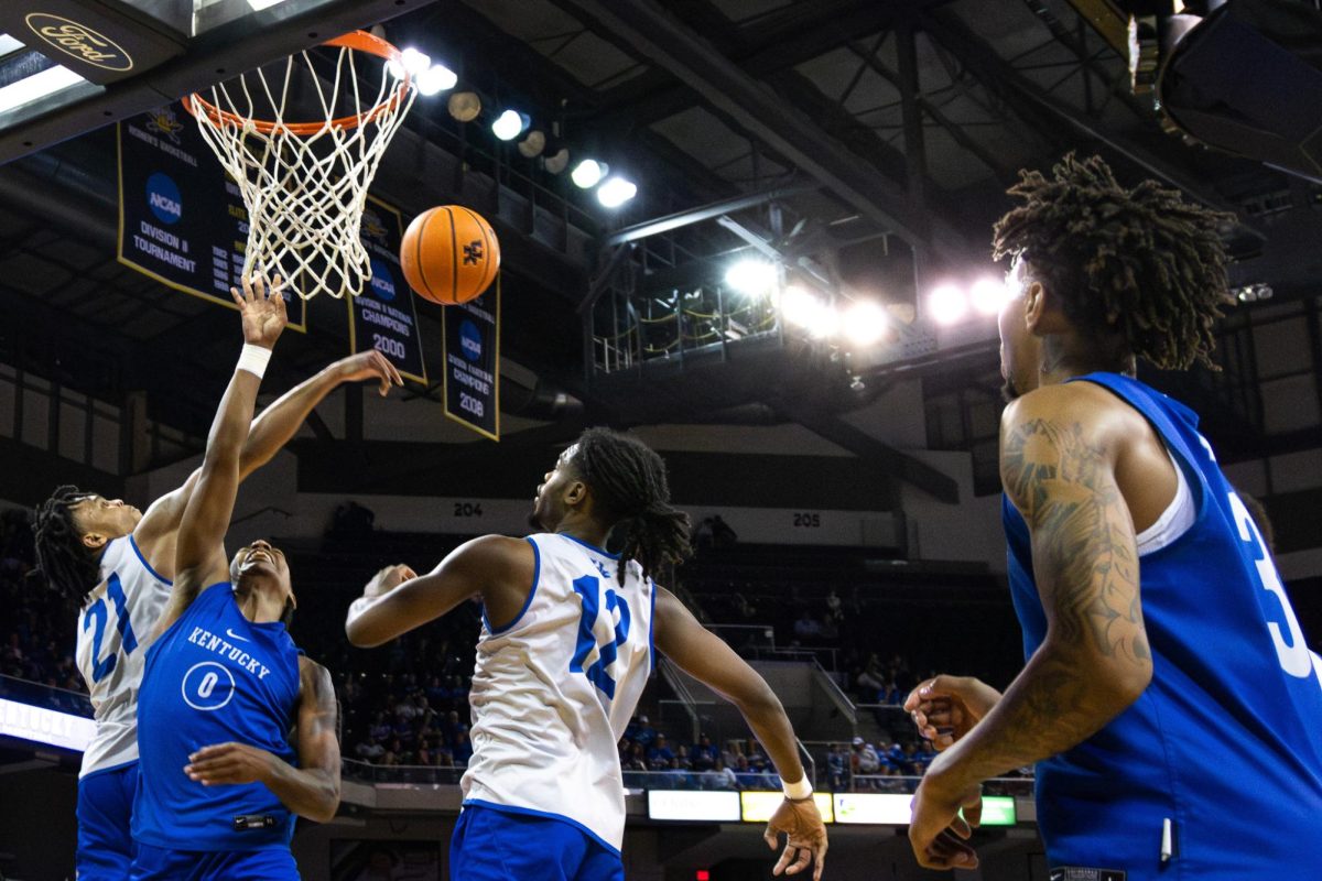 Kentucky guard D.J. Wagner (21) blocks the ball during the Kentucky mens basketball Blue-White game on Saturday, Oct. 21, 2023, at Truist Arena in Highland Heights, Kentucky. The Blue team won 100-89. Photo by Samuel Colmar | Staff
