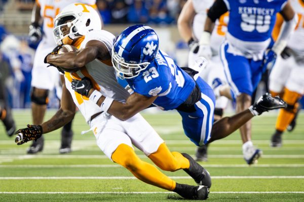 Tennessee wide receiver Squirrel White (10), left, is tackled by Kentucky defensive back Andru Phillips (23) during the Kentucky vs. Tennessee football game on Saturday, Oct. 28, 2023, at Kroger Field in Lexington, Kentucky. Kentucky lost 33-27. Photo by Samuel Colmar | Staff