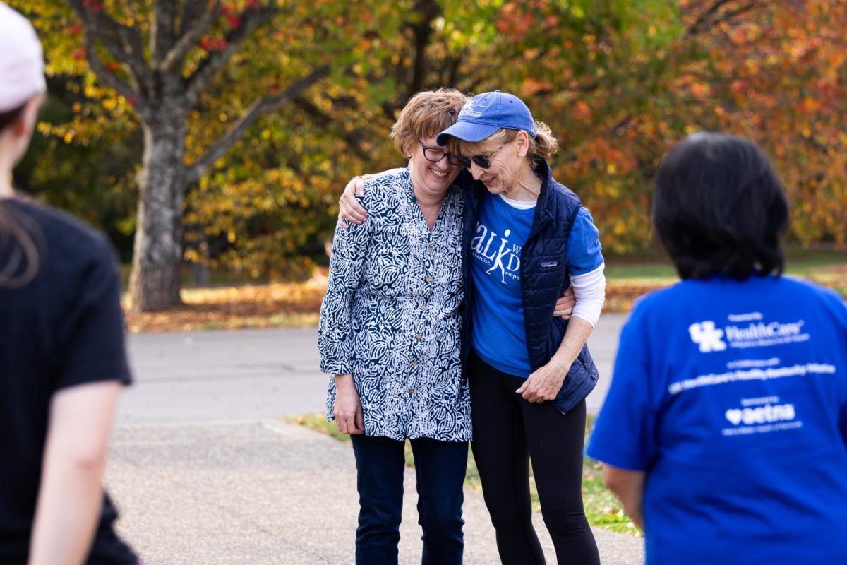 Guest speaker and licensed acupuncturist Norah Charles, left, hugs CareBlue Medical Director Connie Jennings during the Walk With a Doc event on Tuesday, Oct. 24, 2023, at the Arboretum, State Botanical Garden of Kentucky in Lexington, Kentucky. Photo by Samuel Colmar | Staff