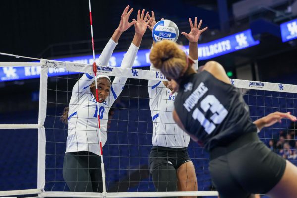 Kentucky outside hitter Reagan Rutherford and middle blocker Azhani Tealer go up for the block during the Kentucky vs Texas A&M volleyball game on Thursday, Nov. 16, 2023, at Rupp Arena in Lexington, Kentucky. Kentucky won 3-1. Photo by Sydney Yonker | Staff