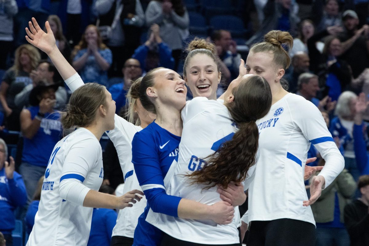 Kentucky players hug in celebration after the Kentucky vs. Missouri volleyball game on Sunday, Nov. 19, 2023, at Rupp Arena in Lexington, Kentucky. Kentucky won 3-1. Photo by Kolby Wohl | Staff