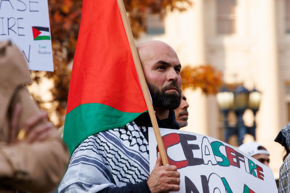 A man stands holding a sign that reads Ceasefire now in protest against the conflict happening in Palestine on Nov 7, 2023, in Frankfort Kentucky. Photo by Matthew Mueller | Staff
