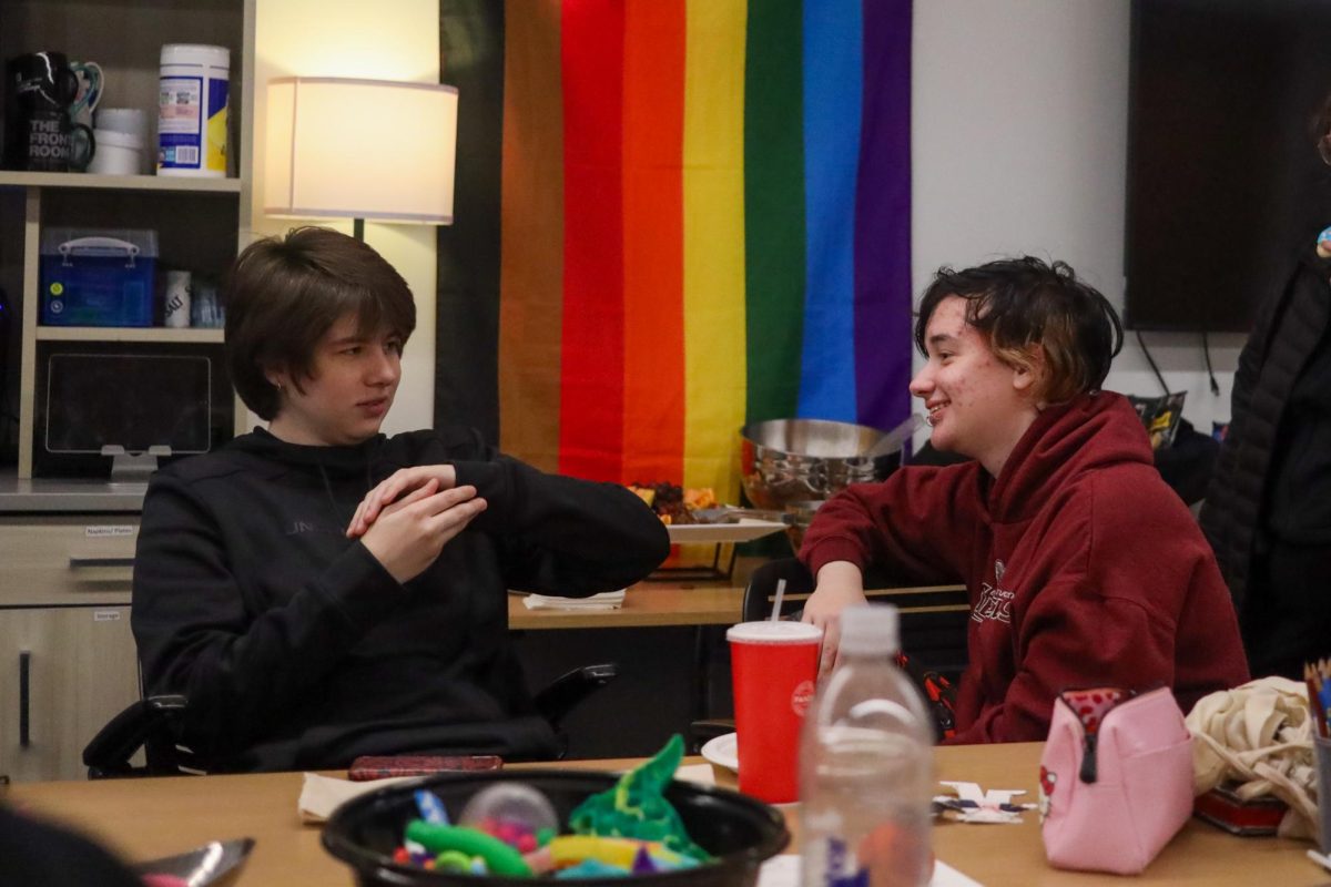 Alex Perry and Alex Nacke laugh during the Trans Pride Party event on Nov. 15, 2023, in Lexington, Kentucky, at the Gatton Student Center. Photo by Matthew Mueller | Staff