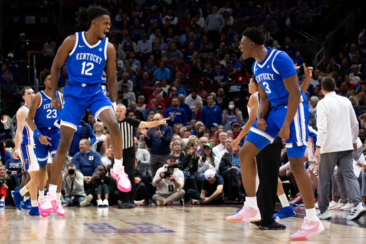 Kentucky guards Antonio Reeves (12) and Adou Thiero (3) celebrate a successful three-pointer during the No. 17 Kentucky vs. No. 1 Kansas mens basketball game on Tuesday, Nov. 14, 2023, in the State Farm Champions Classic at the United Center in Chicago, Illinois. Photo by Brady Saylor | Staff