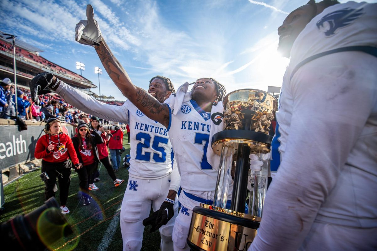 Kentucky players celebrate after the Kentucky vs. Louisville football game on Saturday, Nov. 25, 2023, at L&N Federal Credit Union Stadium in Louisville, Kentucky. Kentucky won 38-31. Photo by Samuel Colmar | Staff