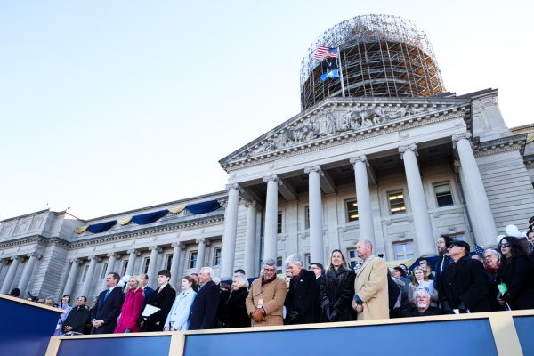 The Beshear family and friends stand during the Armed Forces Salute during the 62nd Kentucky inauguration ceremony on Tuesday, Dec. 12, 2023, at the Kentucky State Capitol in Frankfort, Kentucky. Photo by Abbey Cutrer | Staff