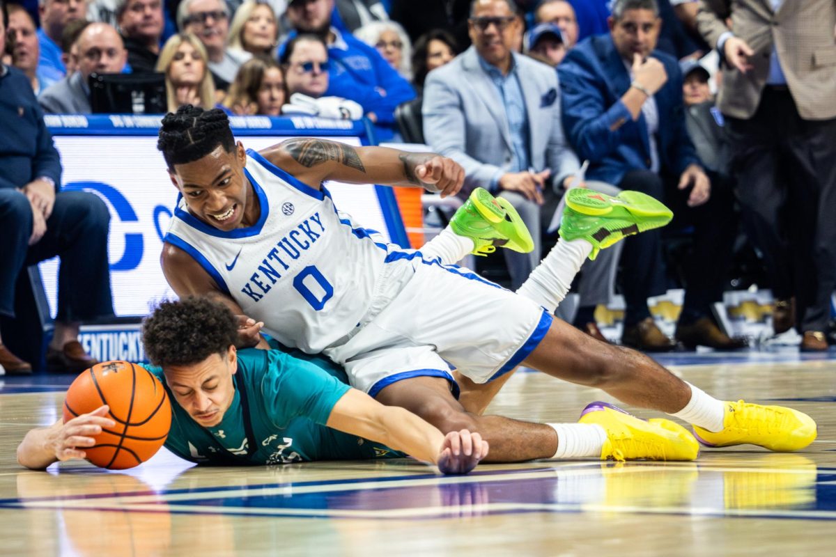 Kentucky guard Rob Dillingham (0) dives for the basketball during the Kentucky vs. North Carolina Wilmington mens basketball game on Saturday, Dec. 2, 2023, at Rupp Arena in Lexington, Kentucky. Photo by Samuel Colmar | Staff
