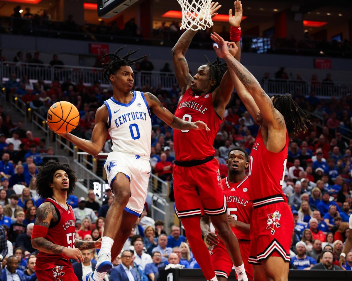 Kentucky guard Rob Dillingham passes the ball during the Kentucky vs. Louisville men’s basketball game on Thursday, Dec. 21, 2023, at the KFC Yum! Center in Louisville, Kentucky. Kentucky won 95-76. Photo by Abbey Cutrer | Staff