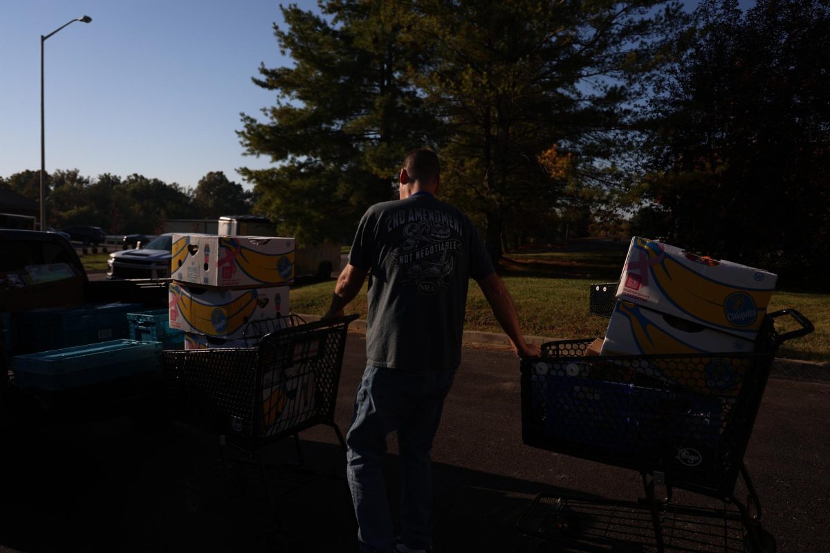 Brian Pedigo pushes two carts full of donated groceries from Kroger for the ACCESS Soup Kitchen and Men’s Shelter on Friday, Oct. 13, 2023 in Frankfort, KY. The groceries will be used to cook the shelter’s daily lunches and offered for free to those who come in. Photos by Hannah Stanley