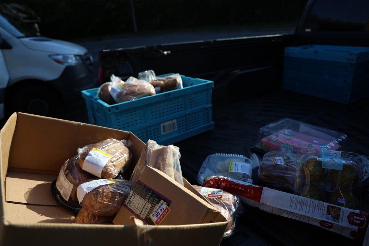 Donated groceries from Kroger are placed in the bed of the ACCESS Soup Kitchen and Men’s Shelter’s truck to be cooked or offered to people who attend the daily free lunches on Friday, Oct. 13, 2023 in Frankfort, KY. Photo by Hannah Stanley