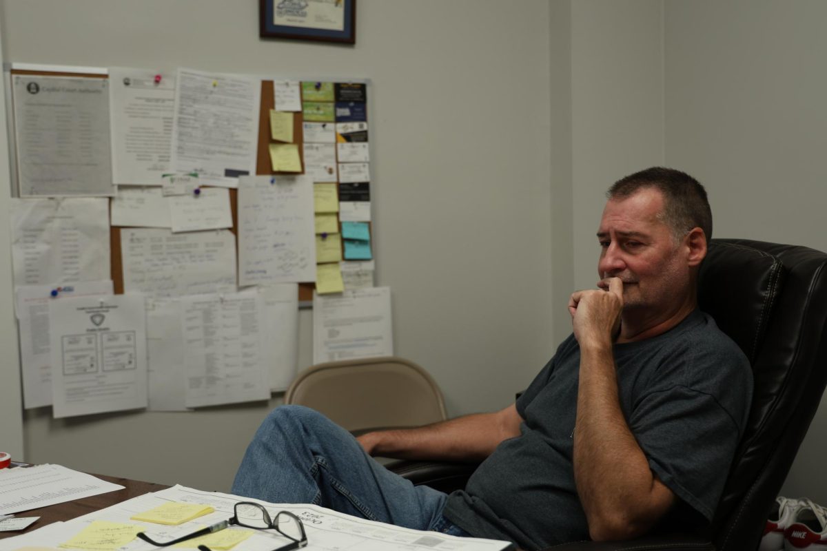 Brian Pedigo sits at his desk in his office at the ACCESS Soup Kitchen and Men’s Shelter on Friday, Oct. 13, 2023 in Frankfort, Ky. Photo by Hannah Stanley